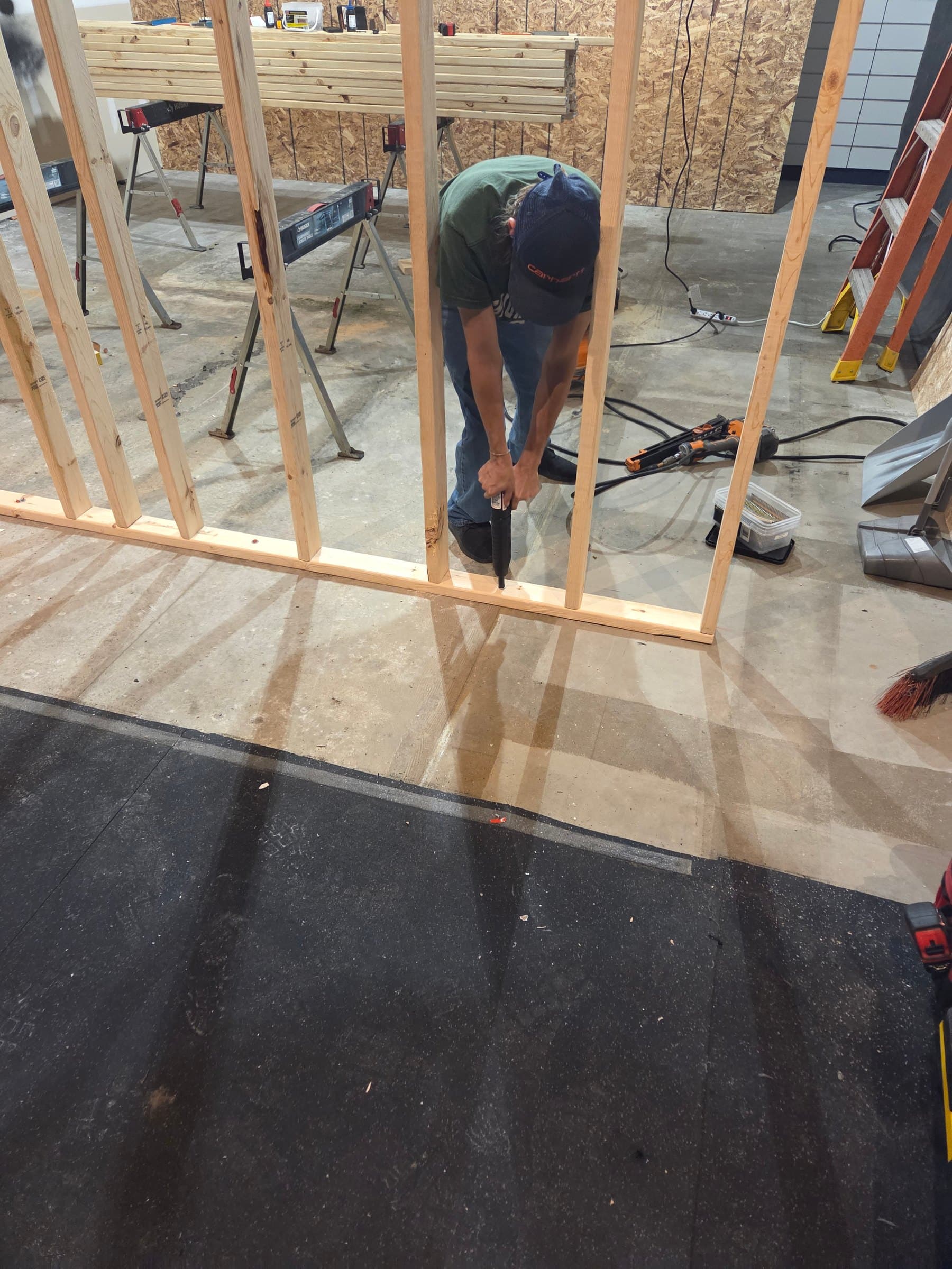Ramset into bottom plate to secure the new walls